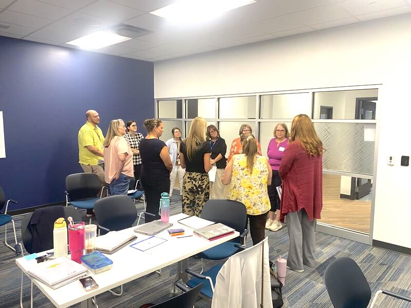 A collaborative team of educators engaging in a strategic planning session